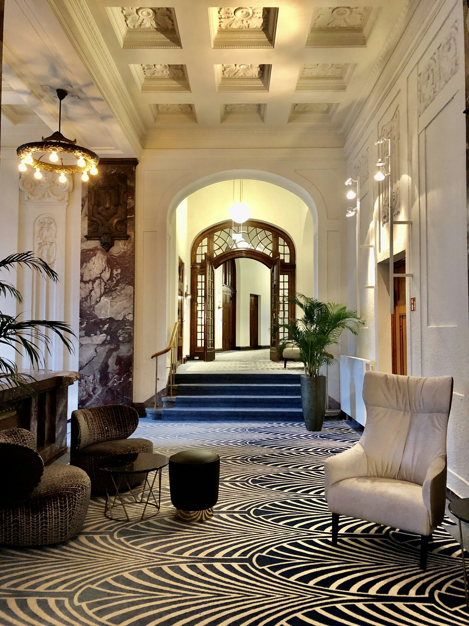 A grand, elegant hotel hallway, beautifully finished and completely empty
